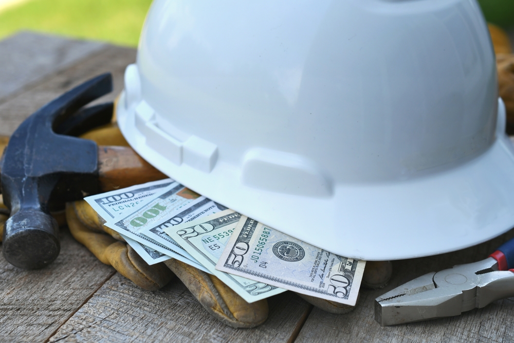 Hard,hat,with,construction,tools,and,cash,money, ,concept
