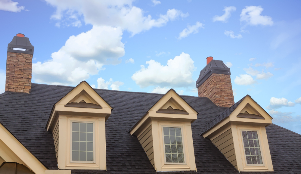Three,dormers,and,two,chimneys